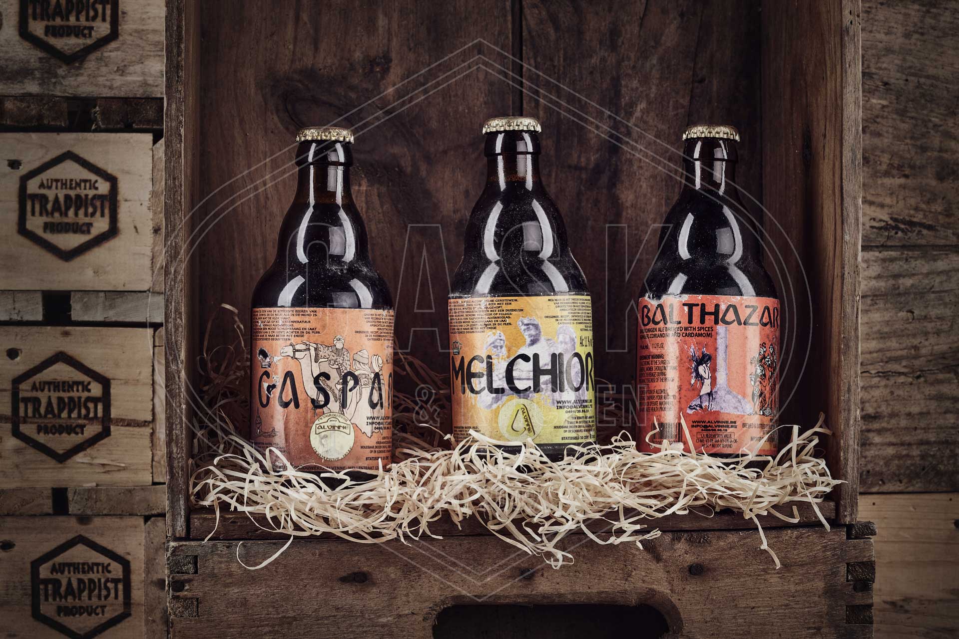 3 beer bottles in a vintage crate